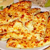 I am from Georgia and my favorite traditional food is khachapuri, it's very yummy, and I think it's look like pizza

Khachapuri (хачапури) is a Georgian bread s|mariam gogiavaさん