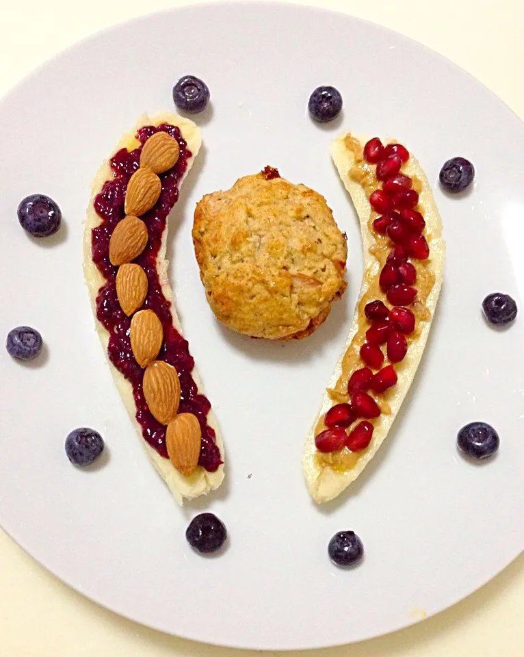 Snapdishの料理写真:Today's simple breakfast - 'banana split'. One half with berry chia jam & almond, the other peanut butter & pomegranate. Ham & cheese muffin in the centre|coxiella24さん