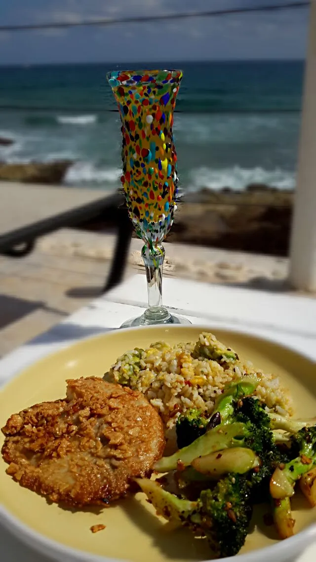 Snapdishの料理写真:Tortilla crusted tilapia with sautéed salsa broccoli and avocado fried rice accompanied with a glass of mimosa.|Jiraphon Gさん