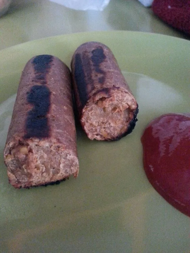 very burnt Apple wood smoked vegan"chix"sausages with ketchup.|Polly Gelfusoさん