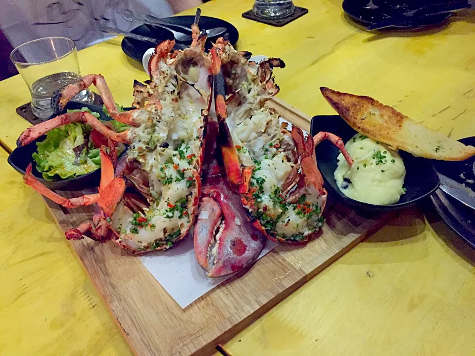 Snapdishの料理写真:Grilled lobster in shell with chili and garlic butter|PhUnGさん