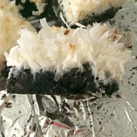 Snapdishの料理写真:Dark chocolate brownie with whipped coconut icing|Lisa Nelsonさん