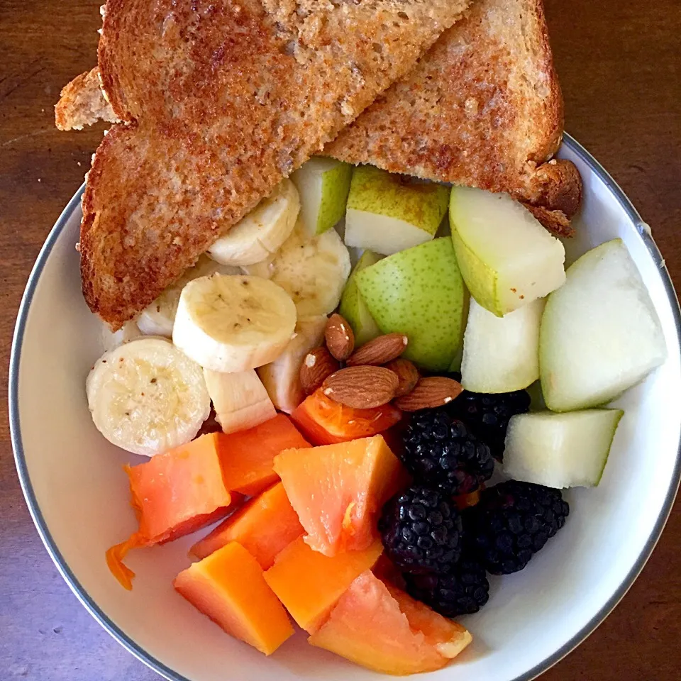 Fruit bowl with whole wheat toast|victoria valerioさん