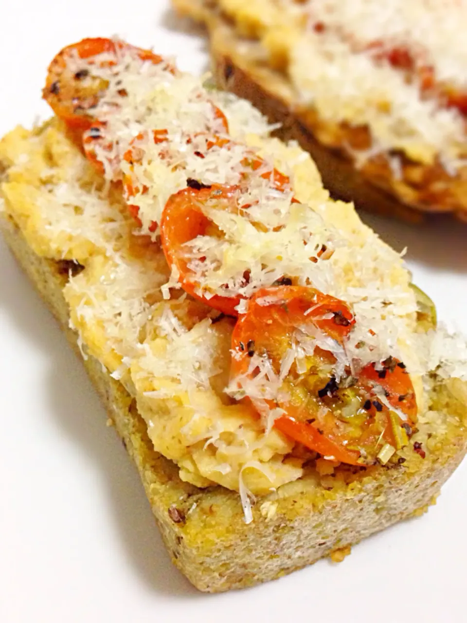 Today's breakfast - paprika hummus with roasted tomato and Parmesan cheese on toast|coxiella24さん