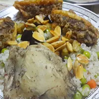 Snapdishの料理写真:batata mobatana and rez beriany libyan dish  potatoes filled with minced meat mixed with  parsley and  deep fried  and rice with vegetables|irisさん