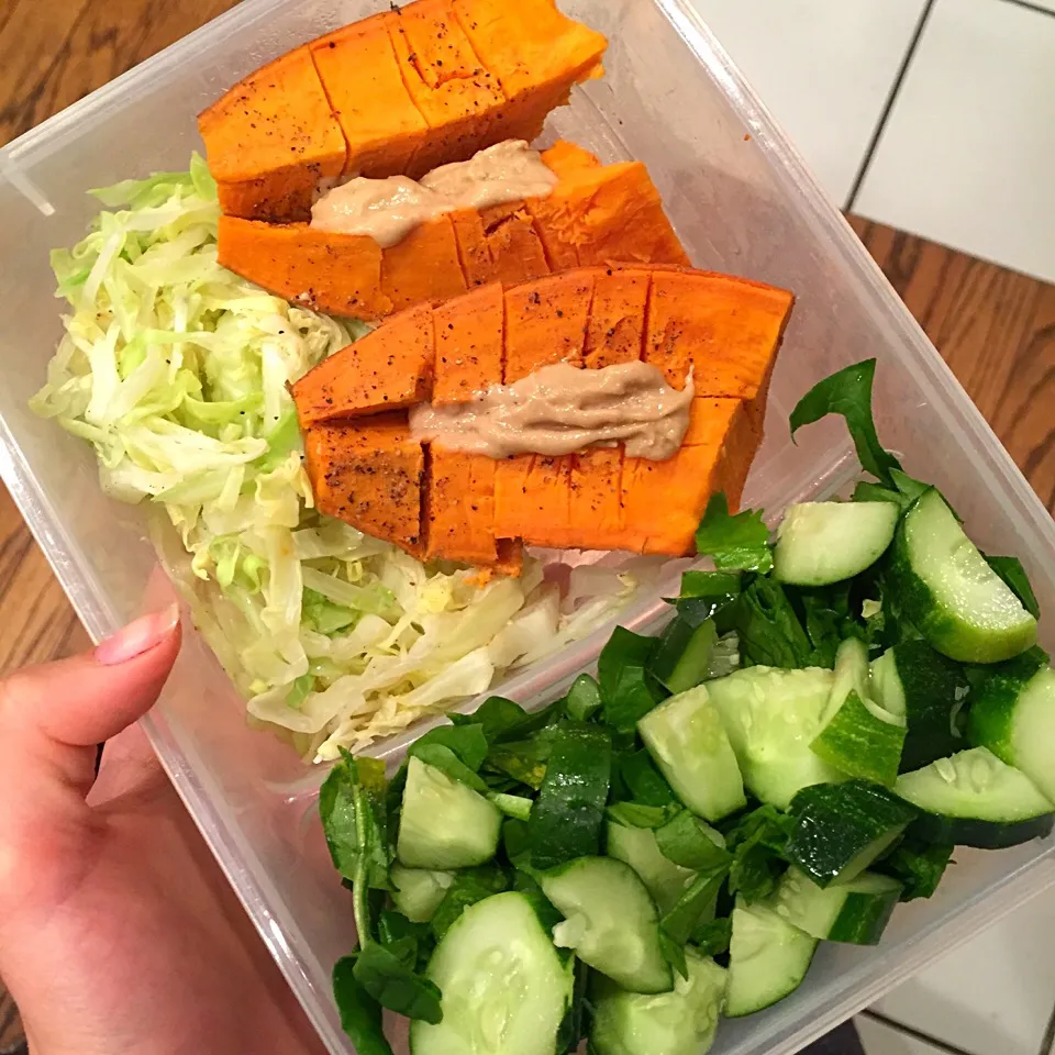 School lunch: steamed sweet potato with tahini sauce and a side of cooked cabbage, raw spinach and cucumber|victoria valerioさん