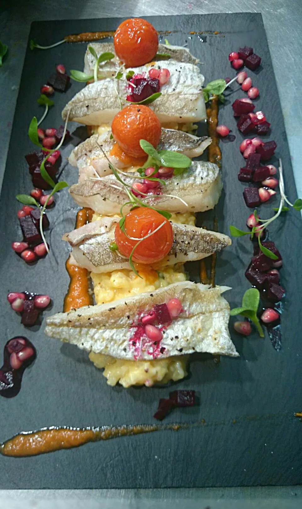 Pan fried whiting, risotto, confit cherry tomatoes, beetroot and pomegranate dressing.|lee mastinさん