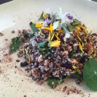 Quinoa pistachio currents parsley salad lots of edible flowers on top|bruce glazerさん