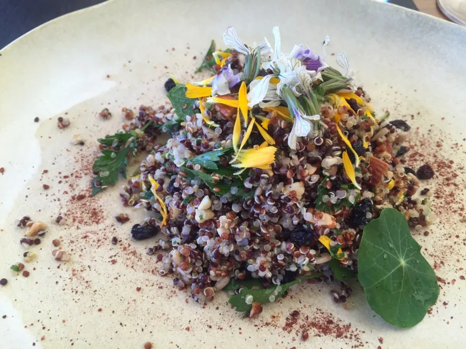 Quinoa pistachio currents parsley salad lots of edible flowers on top|bruce glazerさん