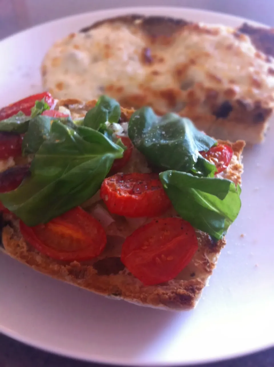 Vegetarian breakfast - tomato, sweet white onion and basil on olive ciabatta and mozzarella with nutmeg on the other slice.  Salt, pepper and olive oil.  Delish|🍓Jolejo🍓さん