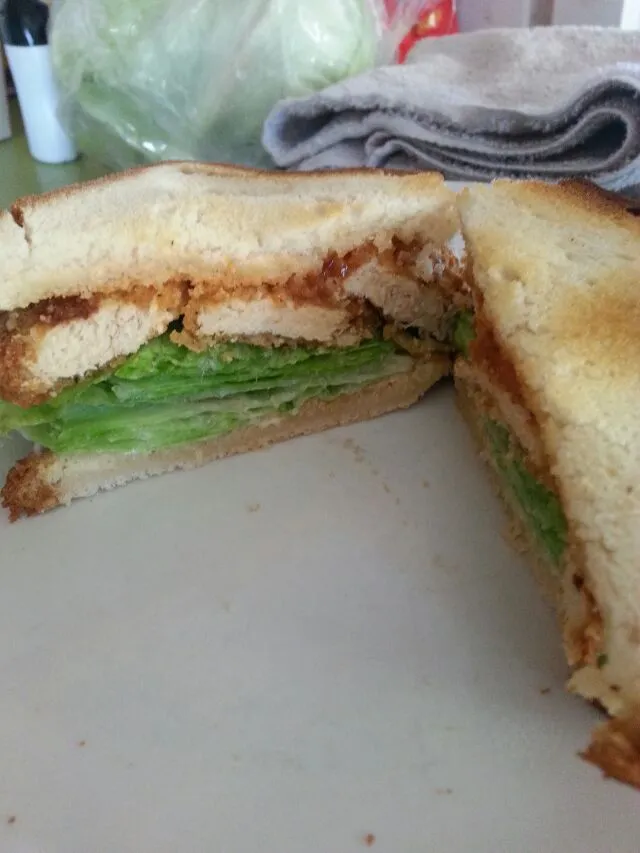 chix tender sandwich with lettuce,  mayo,  And ketchup on brown rice bread.|Polly Gelfusoさん