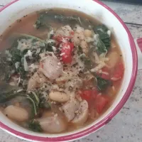 Tuscan white bean and kale souo with tomatoes and chicken apple mapke sausage. topped wuth Parmesan cheese|Gail Fonsさん