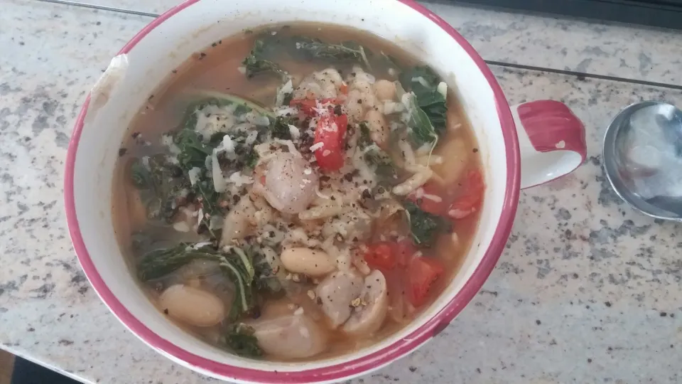 Tuscan white bean and kale souo with tomatoes and chicken apple mapke sausage. topped wuth Parmesan cheese|Gail Fonsさん