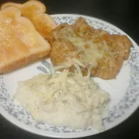 Baked and breaded  pork  chop topped with chadar garlic,onion potatoes  fresh from maine also with chadar and golden  brown  toast with sea salted butter toast|Nicholas  Gillenさん