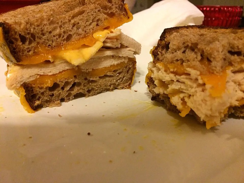 Toasted turkey melt with cheddar and habanero mango aioli on whole wheat sour dough|shykneehighkneeさん