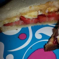 Snapdishの料理写真:peanut butter, banana, and strawberry sandwich on brown rice bread.