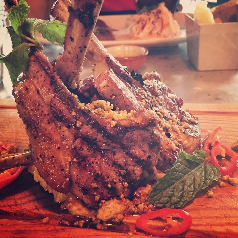 Lamb chop lollipops on a bed of artichoke mash, peppered with red chilli and mint leaves at Jamie's Italian|catwoollyさん