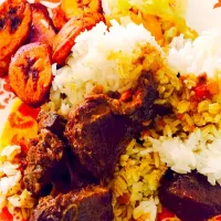 Curry goat with white rice and plantains|melanie suarezさん