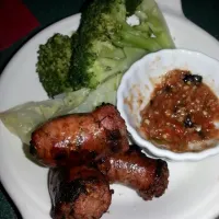 homemade Thai sausages with steamed broccoli and cabbage.