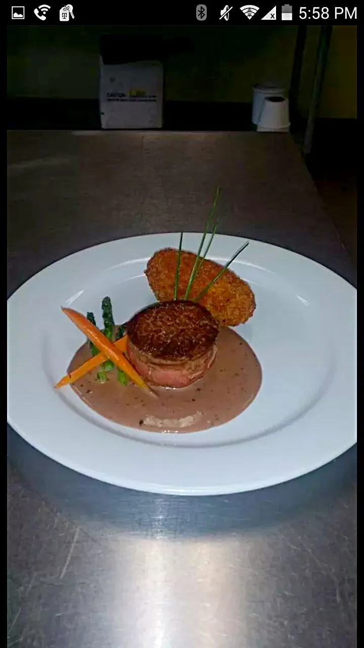 filet mignon with port red sauce and a fried mashed seasoned potato...|mike perezさん