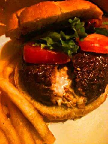 homemade burger stuffed with mixture of diced green/yellow/red peppers, crumbled bacon, cream cheese,scoop of may and sour cream topped off with tomatoes, lettu|mさん