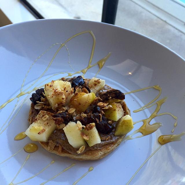 Whole wheat pancakes with almond butter spreadapplesprunescinnamon