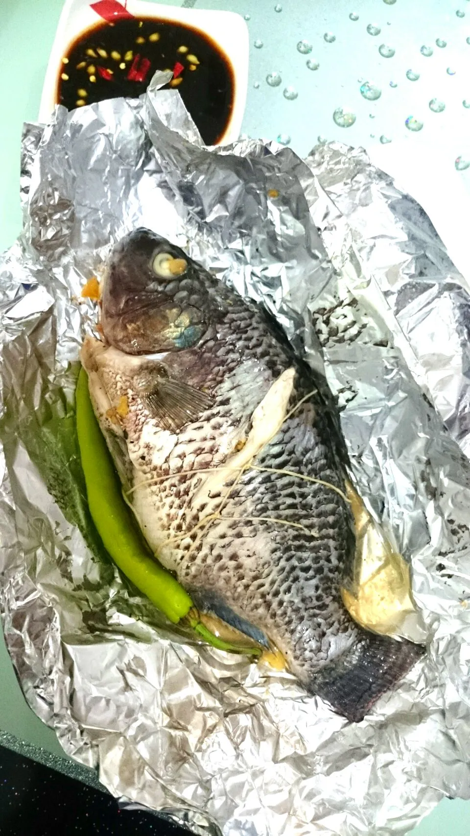 Steamed fish stuffed with ginger,tomatoes,onions and green chilli|bonnieさん