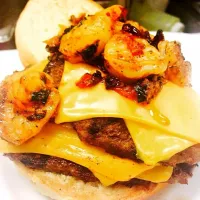 Double cheese kid burger Chula bread with sautéed blackened shrimps and chopping chives and chopping basil and chopping cranberries put top on burger..#foodpic|Brent Baisdenさん