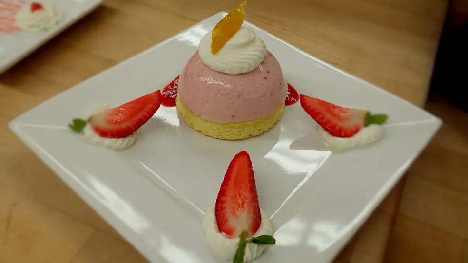 Strawberry Bavarian on top of a vanilla sponge soaked in a lemon simple syrup|Sierra Perezさん