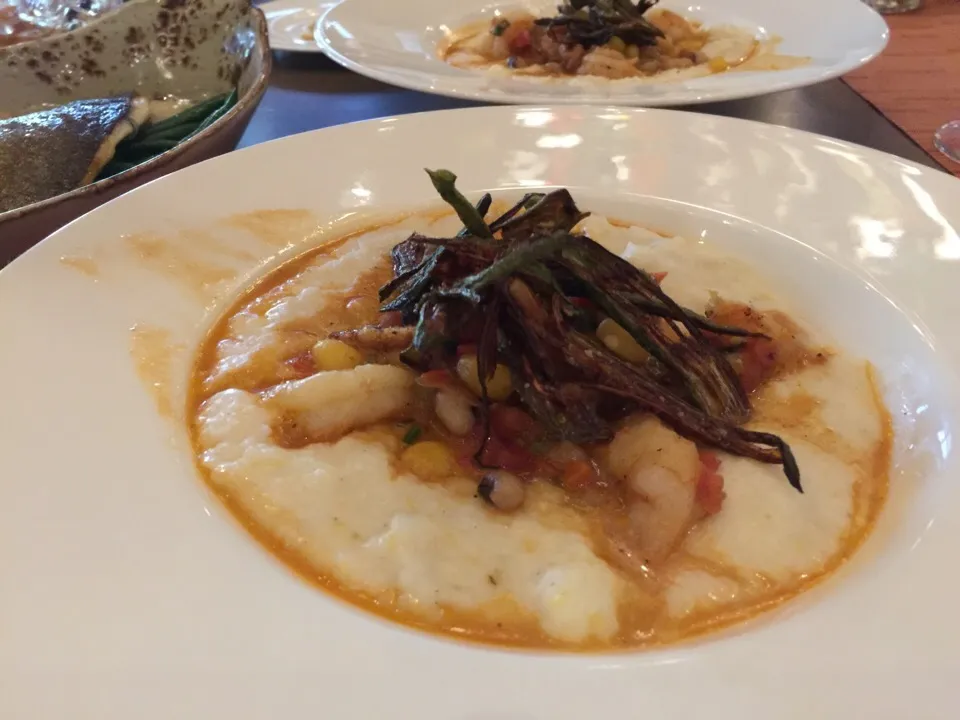 Snapdishの料理写真:Georgia shrimp and grits  Homemade andouille, okra, hominy, field peas, tomato, shrimp scallion broth|Kkartsさん