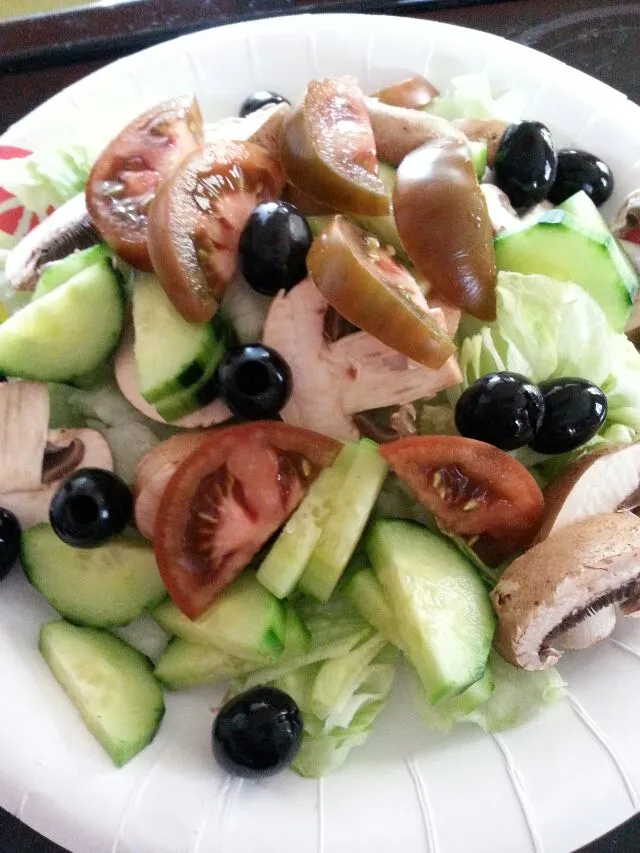 Snapdishの料理写真:today's salad.  ice berg lettuce,  baby Bella,  kumato tomatoes,  cucs,  and olives.|Polly Gelfusoさん