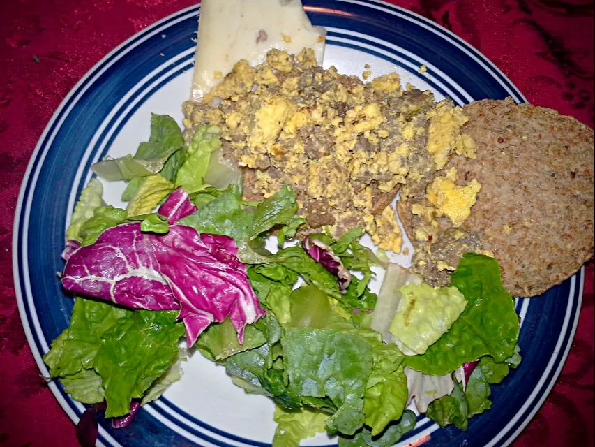 Scrambled duck eggs and sausage on sprouted grain and seed English muffin. Also a side salad and raw horseradish pecan cheddar cheese.|Dawn Nelsonさん