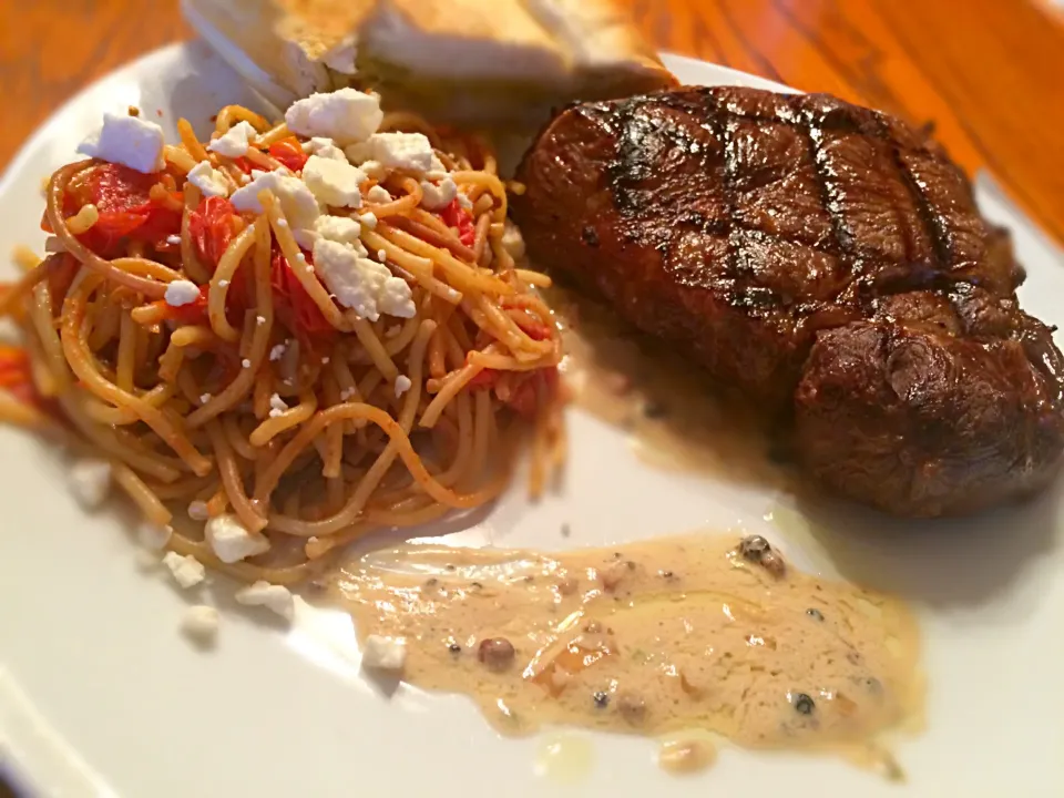 Snapdishの料理写真:Steak over a brandy sauce wig noodles with spicy tomatoes|TJ McAfoosさん