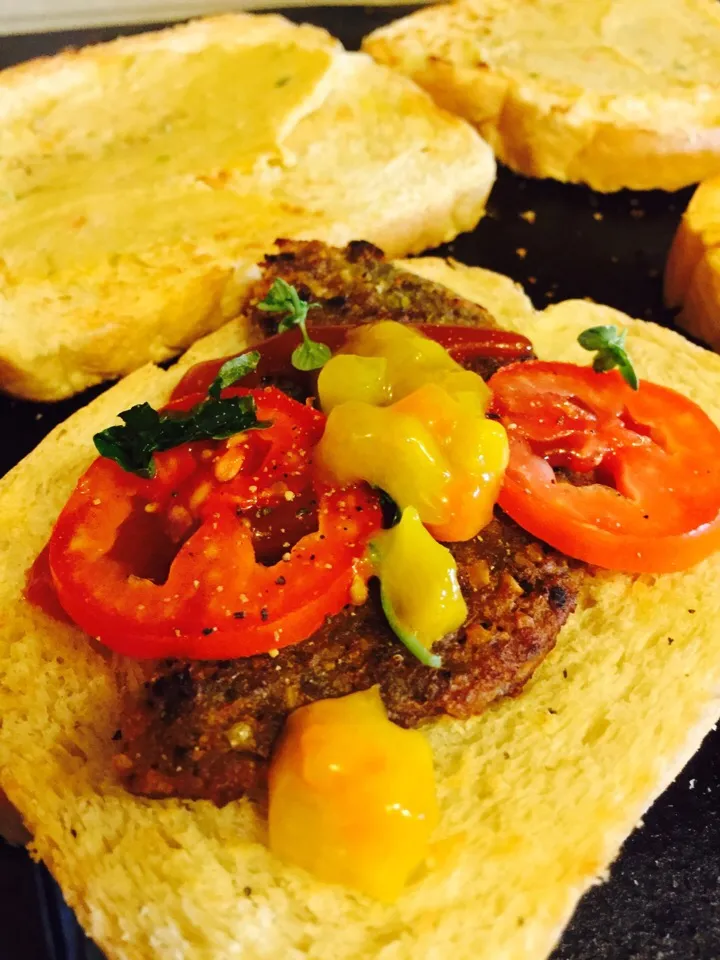 Snapdishの料理写真:Veggie Burger with fresh hummus, piccalilli, tomatoes, basil and lemon balm|kavita maharajさん