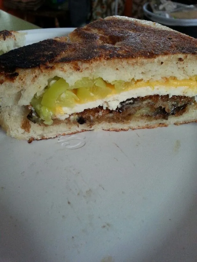 fried eggplant panini. eggplant,  chibatta,  hot pepper,  daiya prov,  Swiss, and American chz.|Polly Gelfusoさん