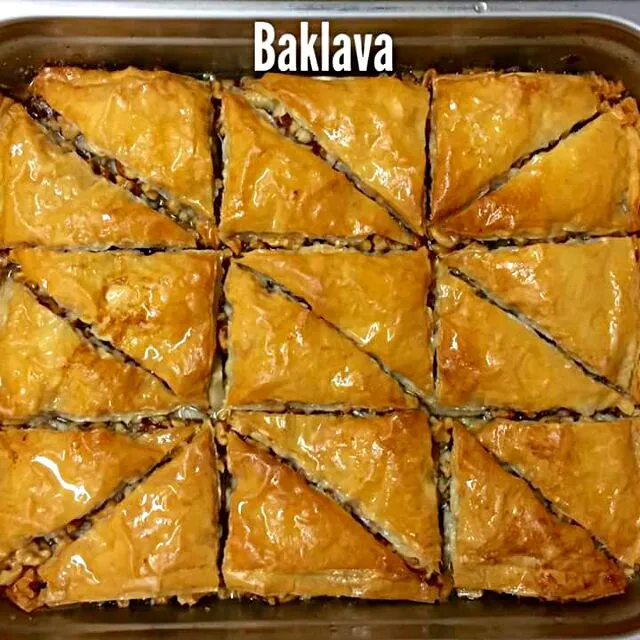 Snapdishの料理写真:baklavaIt is a rich, sweet pastry made of layers of filo filled with chopped nuts and sweetened and held together with syrup or honey|CHUENCHAIさん