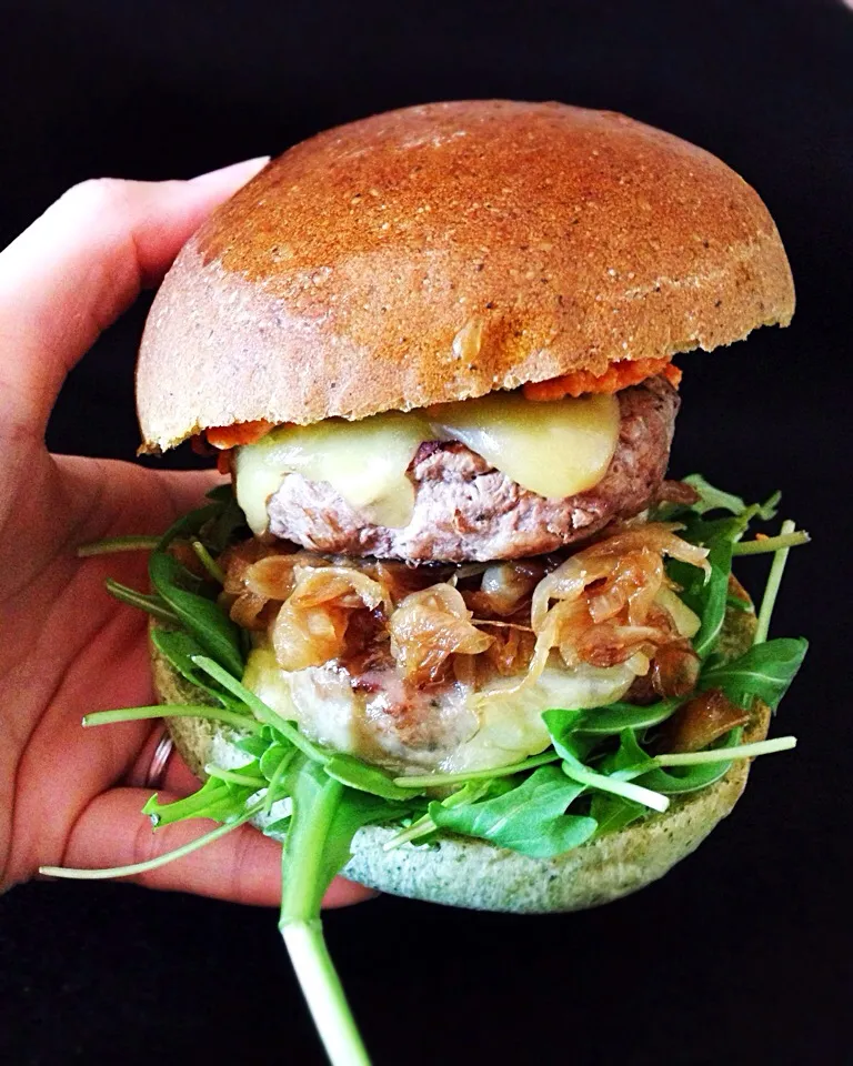 Snapdishの料理写真:Double cheese burger using home made spinach burger buns, with beef-pork patty, caramelized onions, Gouda cheese and rucola|coxiella24さん