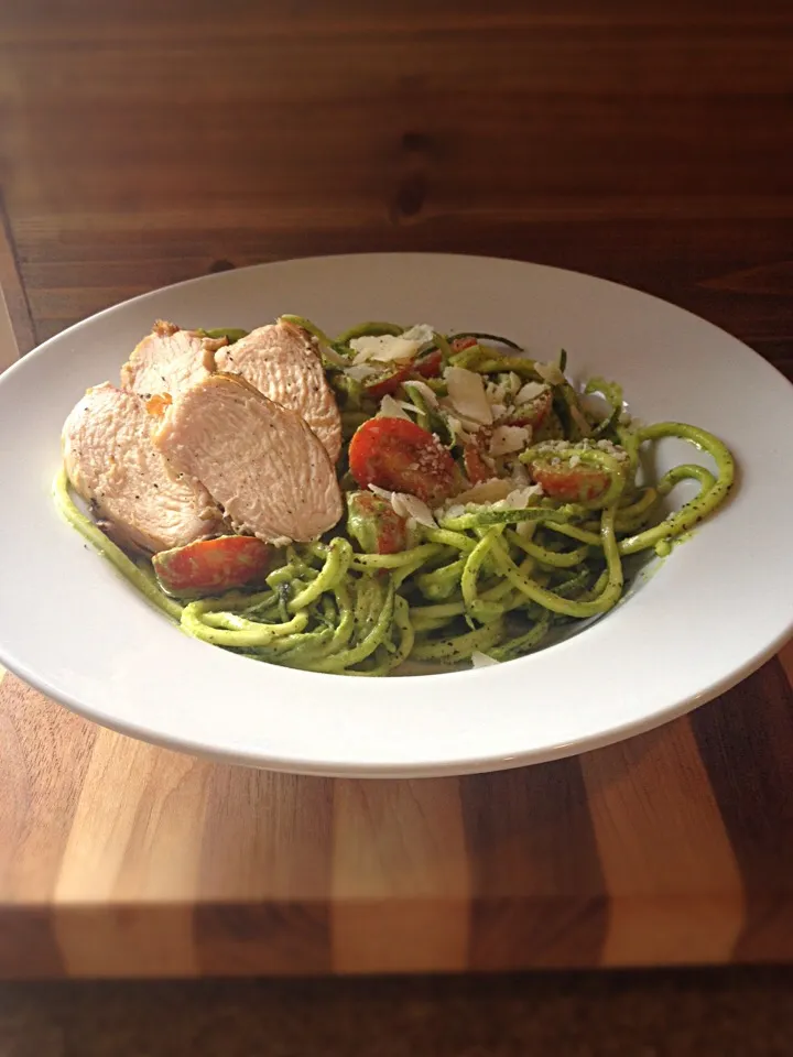 Snapdishの料理写真:Grilled chicken on a bed of raw, spiraled zucchini with avocado/basil/spinach pesto and cherry tomatoes.|Karolynn Krause Cionekさん