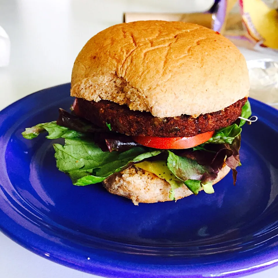 Snapdishの料理写真:Veggie burger with homemade hummus, avocado, lettuce and tomato on a whole wheat bun|victoria valerioさん