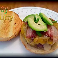 Venison, spicy pork sausage, ground bacon, and onion Juicy Lucy. Stuffed with pepper jack, topped with sharp cheddar, more bacon, avocado, and chives.|Daniel MacDougallさん