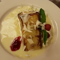 White chocolate bread pudding, white chocolate sauce.|Julia Karma Aguillon-Garciaさん