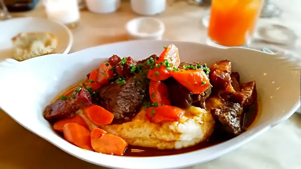 Snapdishの料理写真:Braised beef with glazed carrots,  bacon lardons on top of potatoe puree at Brasserie by niche.|Jihollandさん