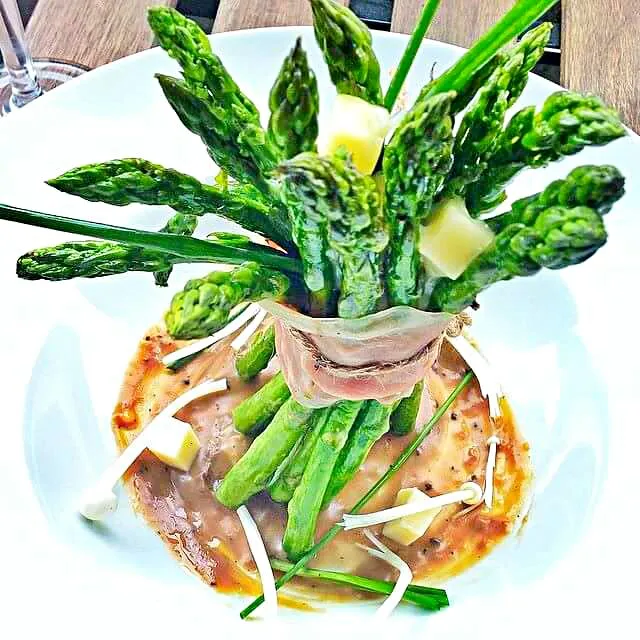 Asparagus Poutine. Poutine is a traditional Canadian dish made with fries, gravy and cheese curds. Try this healthier version of poutine with asparagus, Swiss c|CHUENCHAIさん