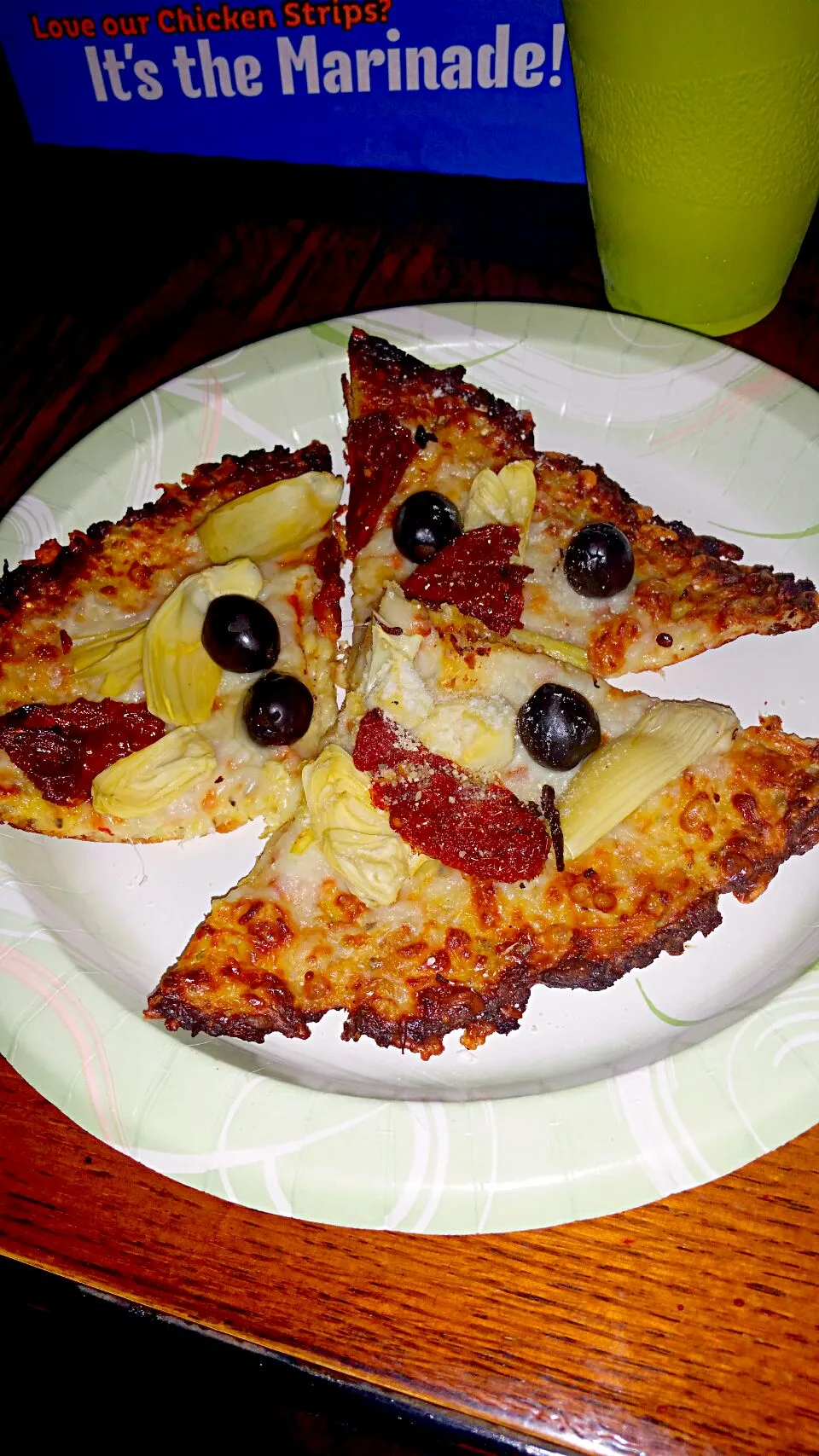 cauliflower pizza crust toppedd with black olives,  sun dried tomatoes and artichoke|Michele Kiddさん