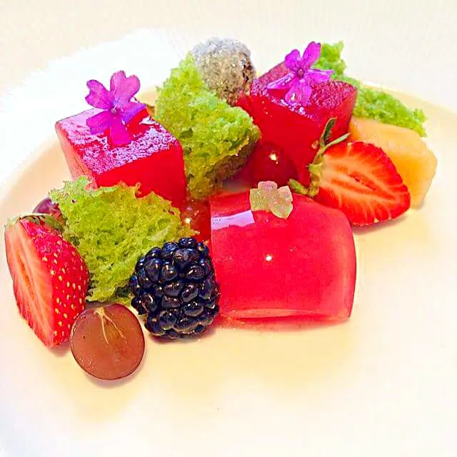 Compressed watermelon, basil cake, watermelon jello sphere with ice inside with pickled watermelon rind along with strawberries, grapes, blackberries and melon|CHUENCHAIさん