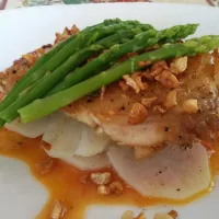 fried buttered garlic snapper. with some boiled potatoes and asparagus and with a tingy tomato sauce .|sherry rodriguesさん