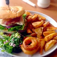 Snapdishの料理写真:Chicken Caesar salad burger and chips with onion rings #onionrings #chips #chicken #burger #bacon #hashbrown #salad|Calum Clarkさん