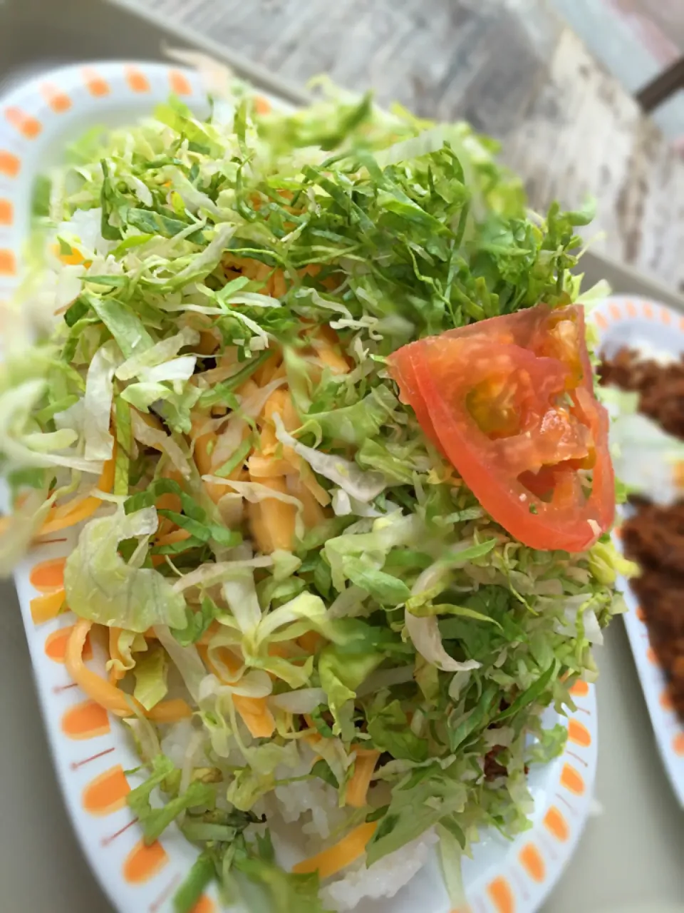 Snapdishの料理写真:キングタコス本店 タコライスチーズ野菜のせ600円|旨い飯好き近藤かずひささん