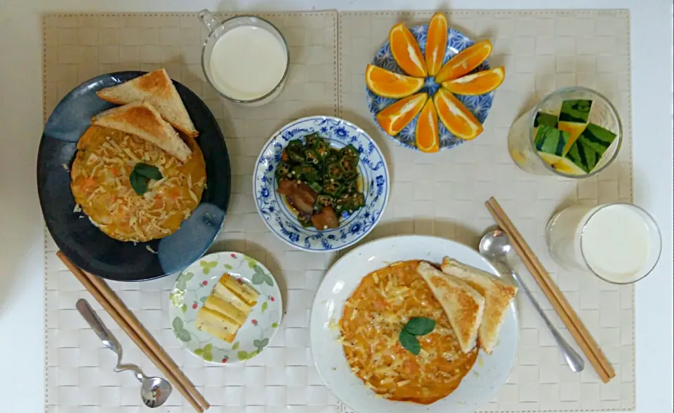 Breakfast for an adult and a kid: pancake(flavor with egg, milk and carrot), mustard cheese, toast, fried gumbo, orange, mini watermelon stick, soy milk and mi|Liciaさん