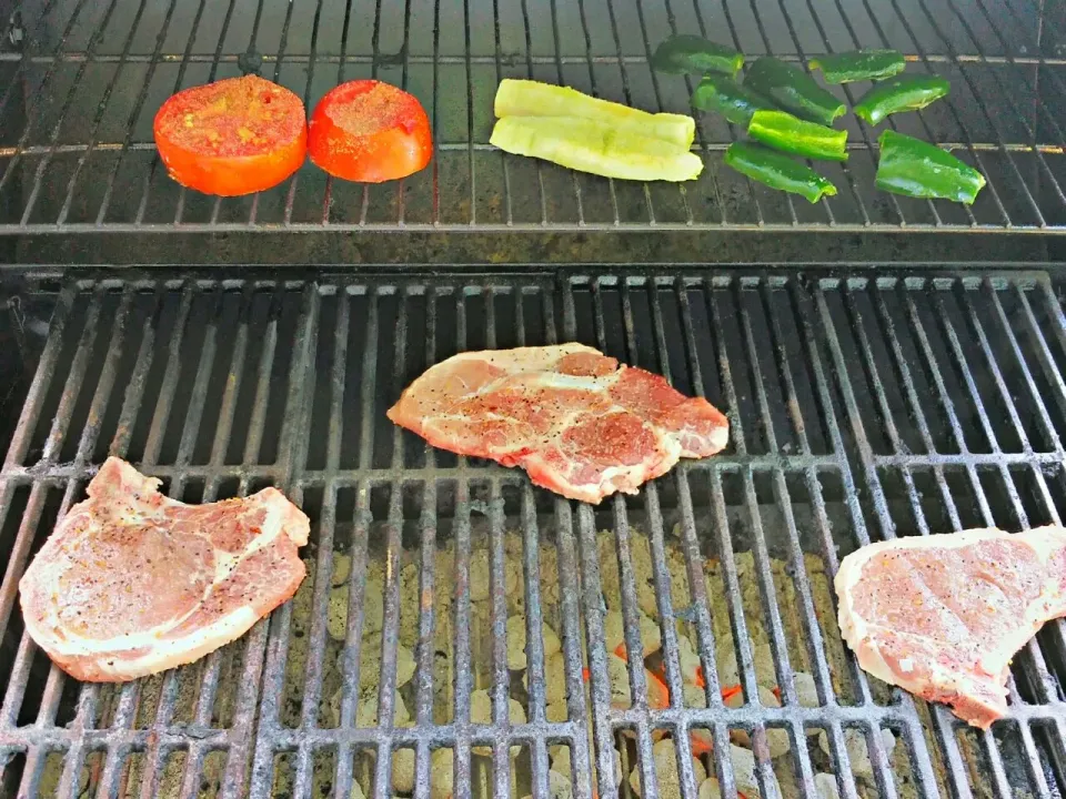 Snapdishの料理写真:Pork chops with Montreal steak rub, jalapenos, and tomatoes and cucumber sprinkled with garlic powder|Joseph Sandersさん